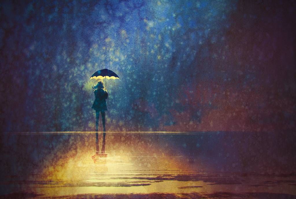 Chica solitaria bajo la lluvia