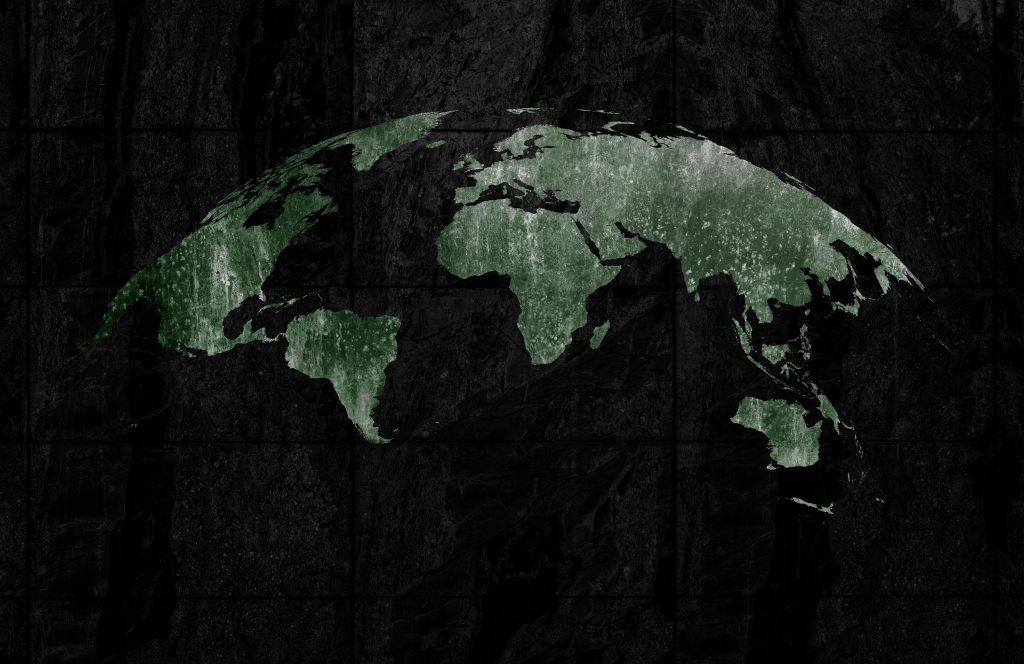 Mapa del mundo verde sobre hormigón