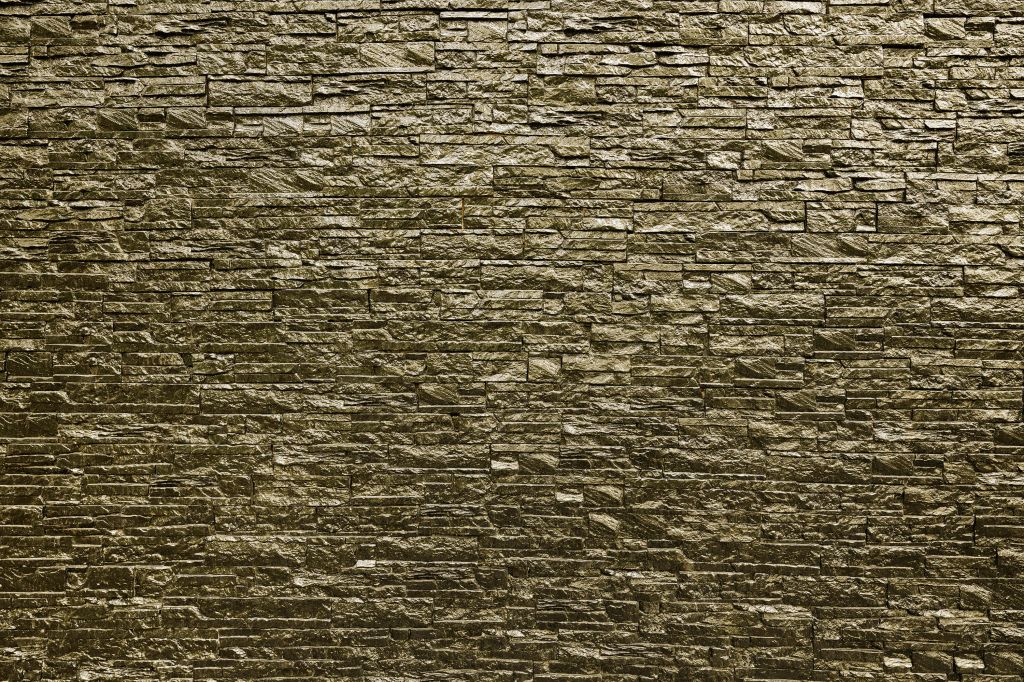 Muro con piedras doradas