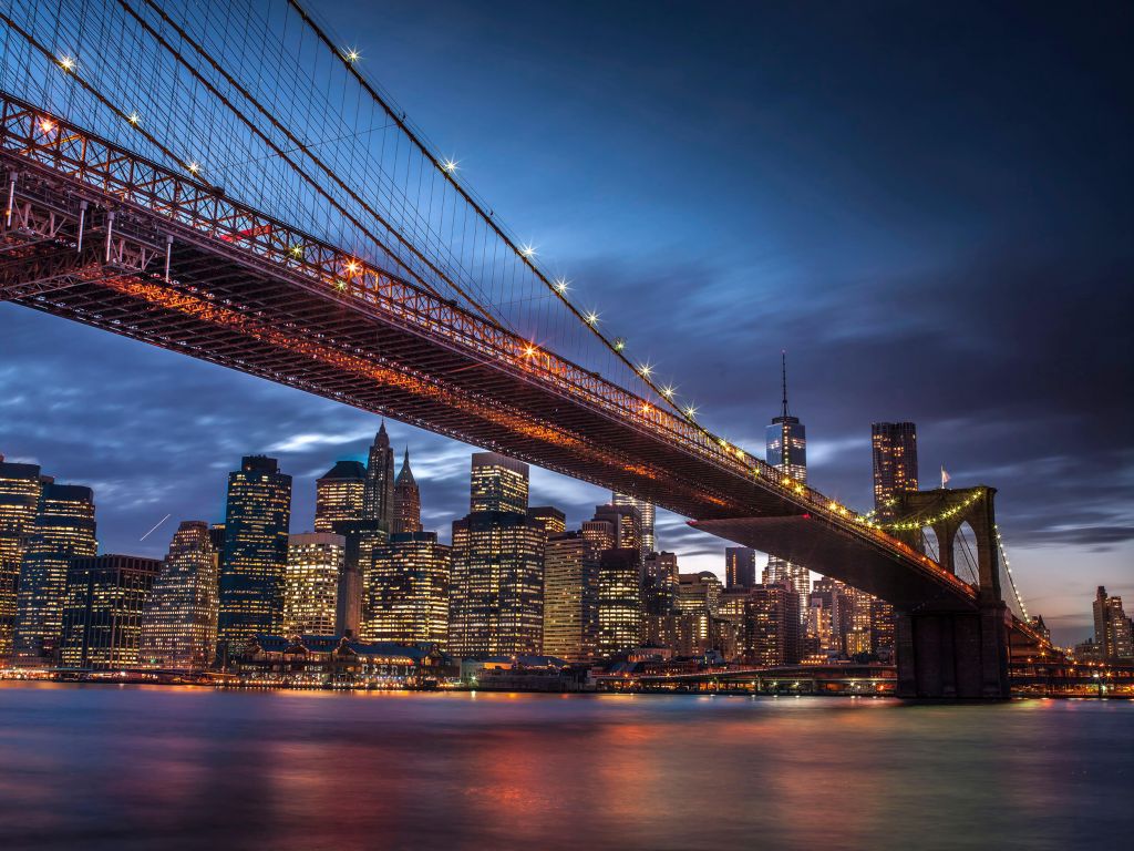 Brooklyn Bridge and lower Manhattan skyline at dusk, New York